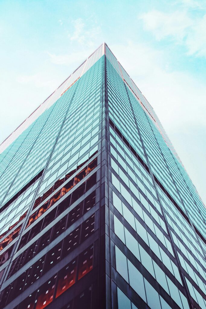 Looking up at a modern skyscraper
